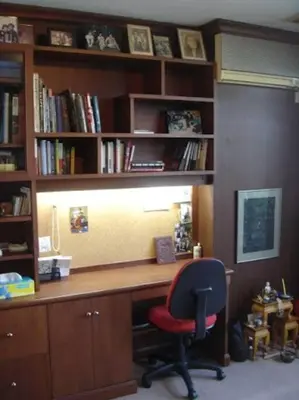 an office with a desk with a chair and book shelves at Stunning 24th Fl Terrace Penthouse! in Bangkok