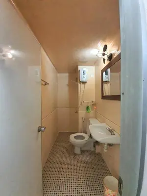 a small bathroom with a toilet and a sink at Great Location At IMPACT ARENA Muang Thong Thani C3 in Pak Kret