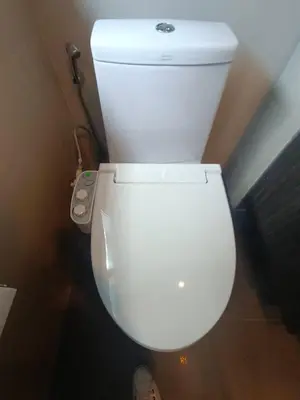 a bathroom with a white toilet in a room at J Residence Thonglor 8 in Bangkok