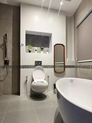 a bathroom with a toilet and a sink and a tub at Usman Halal Home in Bangkok