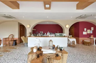 a living room with a table and a counter at VST Punnawithi in Bangkok