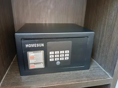 a home system is sitting on a shelf at VIVA LA VIDA HOTEL in Bangkok