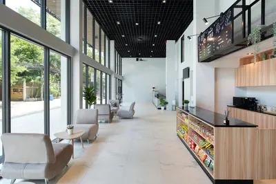 a lobby of a store with chairs and tables at โรงแรมอินฟินิทเกษตร in Ban Yang