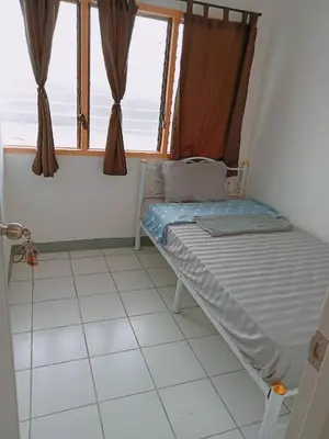 a small bed in a room with a window at 5บีบี 5BB guest house in Bangkok