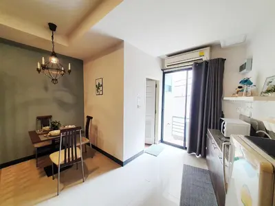 a kitchen and dining room with a table and a dining room at 552 Residence in Bangkok