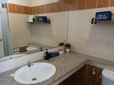 a bathroom with a sink and a mirror at 552 Residence in Bangkok