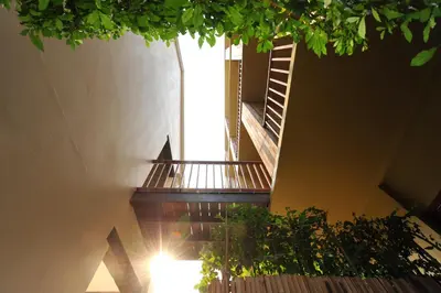 a spiral staircase in a building with a window at Villa Bangkok in Bangkok