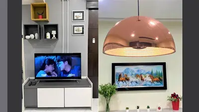 a living room with a flat screen tv and a pendant light at At FOUR-6 Bed, CITY CENTER, Nana BTS, MBK, Central World, Siam in Bangkok