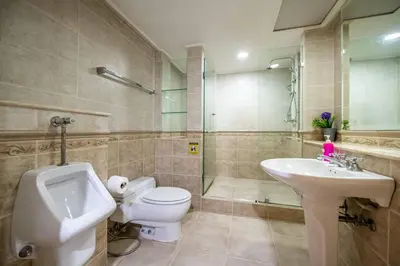 a bathroom with a toilet and a sink and a shower at AT NANA-5Bed, CITY CENTER, Nana BTS, MBK, Central World, Siam in Bangkok