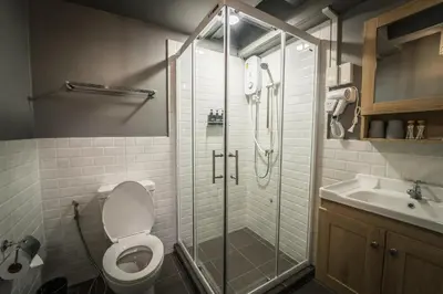 a bathroom with a shower and a toilet and a sink at Canal View Lo-ha guest house, Contactless Check-in in Bangkok