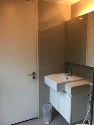 a bathroom with a sink and a mirror at Livat5r1042 in Makkasan