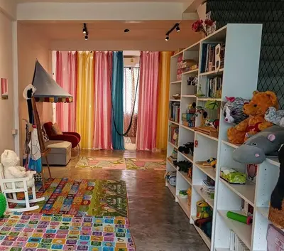 a living room with shelves filled with stuffed animals at Beautiful 5 Story Family House in Bangkok