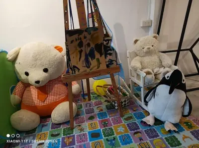 two stuffed teddy bears sitting next to each other at Beautiful 5 Story Family House in Bangkok