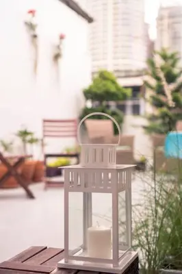 a white bird feeder sitting on top of a table at Beautiful Super Modern Gigantic Designer Home in Bangkok