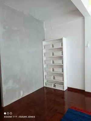 a white book shelf in a room at Big Groups Heaven in Central Location in Bangkok