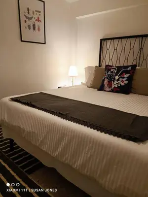 a bedroom with a large bed with white sheets and pillows at Big Groups Heaven in Central Location in Bangkok