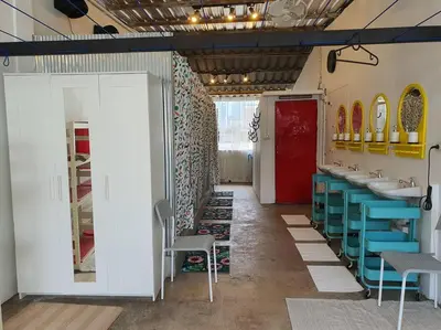 a bathroom with two sinks and a red door at Great House for Families and Big Groups in Bangkok