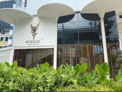 a building with a sign on the side of it at Nato House Ekkamai -BTS Ekkamai with balcony in Bangkok