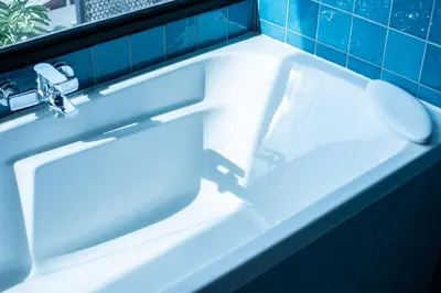 a white bathroom sink with a toilet in it at karaarom hotel in Bangkok