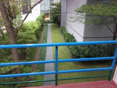 a view of a garden from a balcony at Ban Suanlum in Bangkok