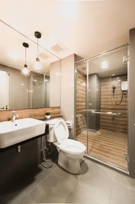 a bathroom with a toilet and a sink and a shower at W2 RESIDENCE in Ban Zong Katiam