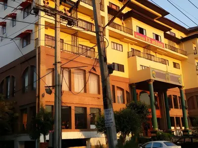 a building on a city street with a pole at OYO 75466 -13 Coins Bang Yai Hotel in Ban Sai Ma