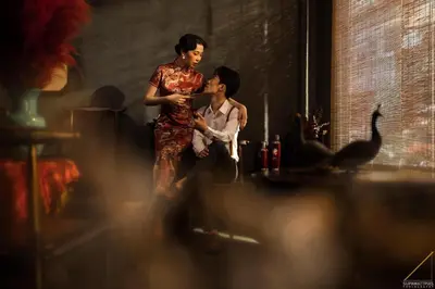a woman standing next to a man in a room at Caiyong Hometel & Cafe's Studio in Khlong San