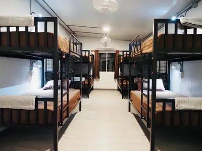 a room with several bunk beds in a dorm at Wild Ones Hostel in Bangkok