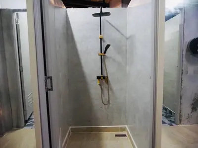 a shower in a room with a glass door at Wild Ones Hostel in Bangkok