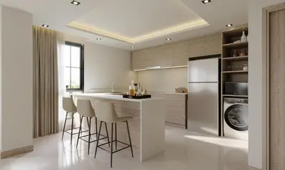 a kitchen with a bar with stools and a refrigerator at Leon Lasalle Hotel and Residences in Bangkok