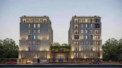 two tall buildings are next to each other at Leon Lasalle Hotel and Residences in Bangkok