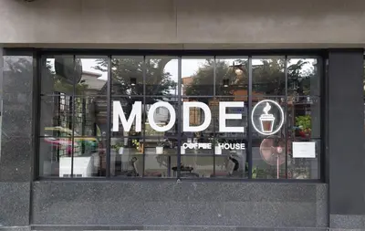 a moco store window with a sign in it at HOUSEMODE - BAANYAI @ Wongwian Yai in Bangkok