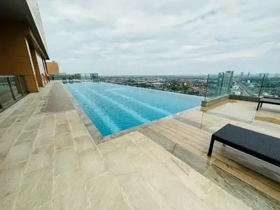 a swimming pool on the roof of a building at Plum central westgate@Bangyai in Ban Bang Krabu