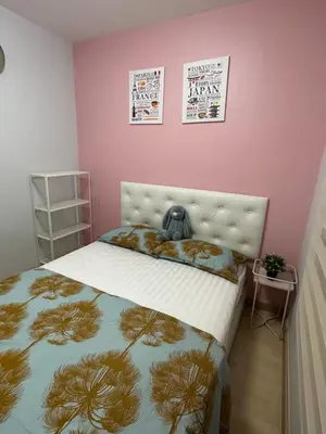 a bedroom with a bed with a stuffed animal on it at S Villa @Impact Muangthongthani in Pak Kret