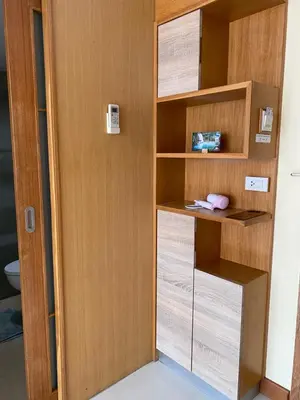 a room with a wooden door and shelves at L18 residence แอลสิบแปด เรสซิเดนซ์ in Ban Zong Katiam