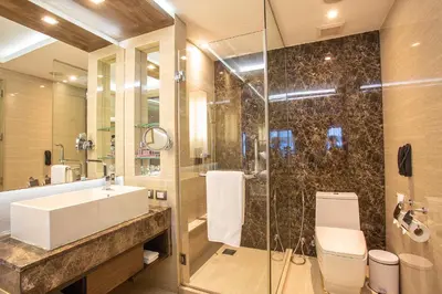 a bathroom with a sink and a shower at Graceland Bangkok by Grace Hotel - SHA Extra Plus in Bangkok