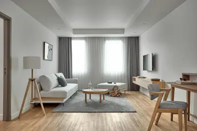 a living room with a couch and a table at Casa 17 Hotel Bangkok in Bangkok
