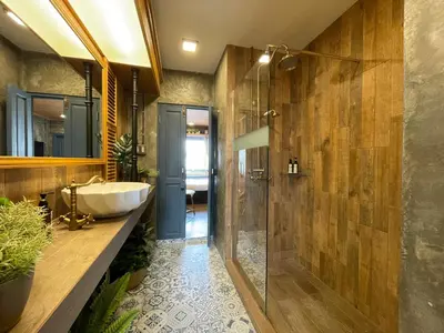 a bathroom with a tub and a sink and a shower at Central Old Town Cottage in Bangkok