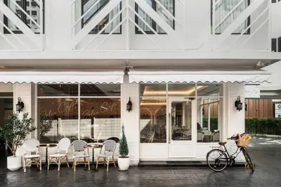a bike parked in front of a restaurant at Lucky Hotel Bangkok in Bangkok