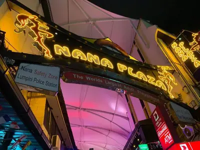 a neon sign for a nanna palace on a building at S.M. GRANDE RESIDENCE in Bangkok