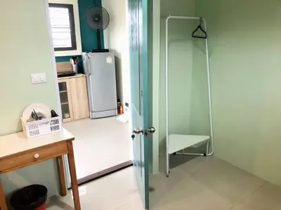 a kitchen with a glass shower and a refrigerator at CB's - Cheap Boutique Bangkok in Bangkok