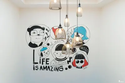 a wall art with the words life is amazing at All day hostel at BTS Bang Chak in Bangkok