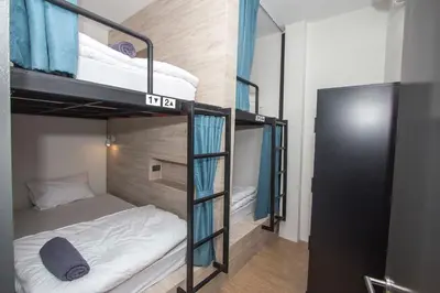 a small room with two bunk beds in it at All day hostel at BTS Bang Chak in Bangkok