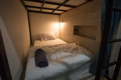 a small room with a bunk bed in it at All day hostel at BTS Bang Chak in Bangkok