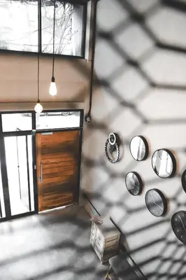 an overhead view of a room with a door and mirrors at The Cube Hostel Khaosan in Bangkok