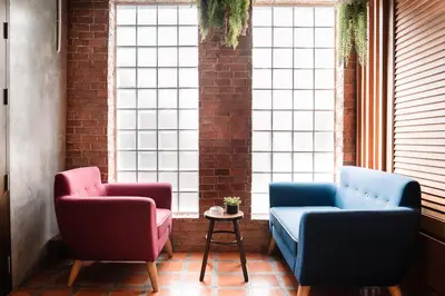 two chairs and a table in a room with windows at CozyHouse near MRT QSCC Convention Center 4BR 10ppl in Bangkok