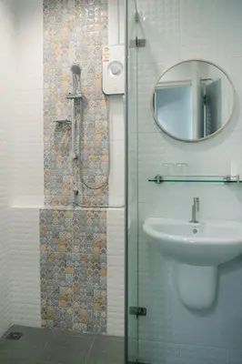 a bathroom with a sink and a mirror at CozyHouse near MRT QSCC Convention Center 4BR 10ppl in Bangkok