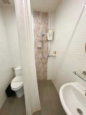 a bathroom with a shower and a toilet and a sink at CozyHouse near MRT QSCC Convention Center 4BR 10ppl in Bangkok