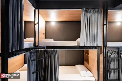a room with bunk beds in a hostel at Bunkbed Hostel in Makkasan
