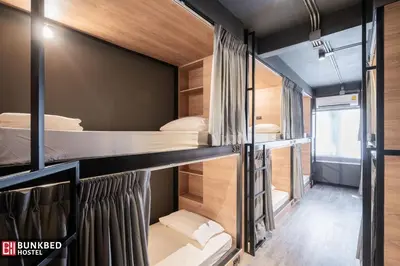 a room with four bunk beds in it at Bunkbed Hostel in Makkasan